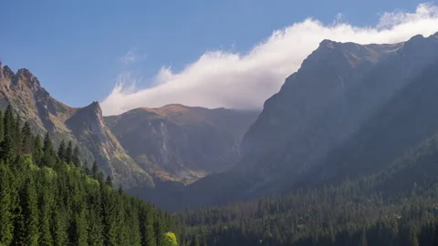 Time lapse mountains, peaks covered with rolling clouds. Epic rocky highlands Stock Footage 162746826