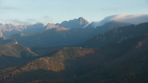 Time lapse mountains, peaks, mountain range covered with clouds in evening Stock Footage 162968971