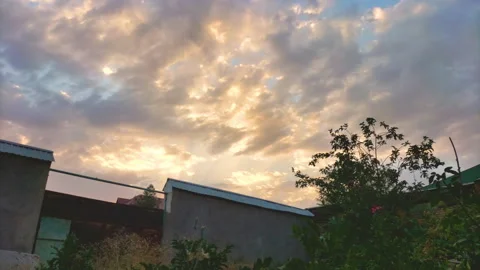 Time lapse of movement of clouds across sky at sunset with change in color,.. Stock Footage 280774549