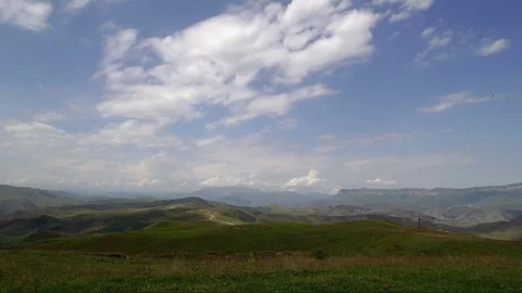 Time Lapse the Movement of Clouds and Cows Grazing on Mountains Stock Footage 82145843