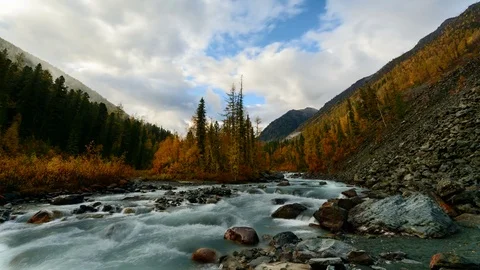 Time Lapse. The movement of clouds over the mountainous river Akkem. Stock Footage 70233130