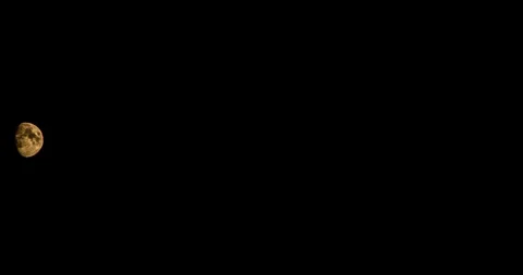 Time lapse of the movement of the moon on a black sky Stock-Footage 129630816