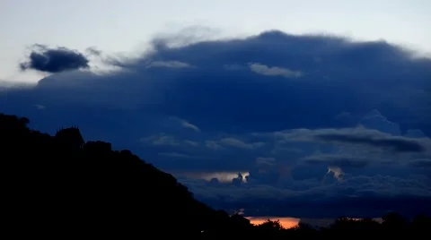 Time Lapse Movie of cloud movement over Mountain at Sunset. Stock Footage 51035534