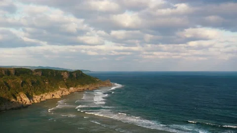 Time Lapse Moving Blue Cloud and Ocean with Long Cape against Sunlight Stock Footage 153591438