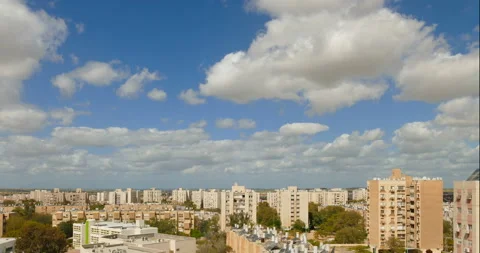 Time-lapse with moving camera down of clouds over a simple city neighborhood 動画素材 93237932