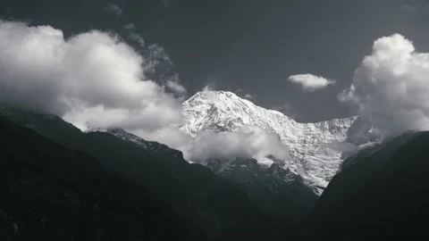 Time-lapse Moving the cloud on sky on peak of mountain covered snow Stock Footage 154020557