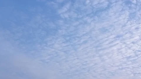 Time lapse: moving clouds against blue sky Stock Footage 243865637