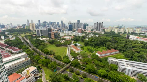 Time lapse of moving clouds and traffic at Tiong Bahru with Singapore cityscape Видео 39776872