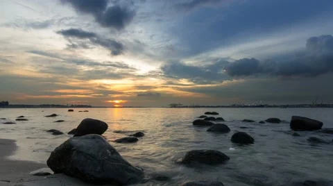 Time lapse of moving clouds and river at sunset in Punggol Singapore 4k uhd Stock Footage 61404413