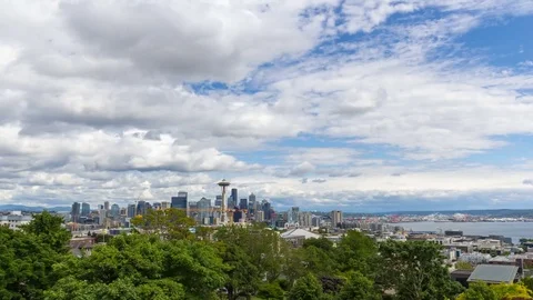 Time lapse of moving clouds and sky over Seattle WA cityscape and Puget Sound 4k Stock Footage 80797857