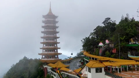 Time lapse of moving clouds and fog over Chin Swee Caves Temple in Malaysia Stock Footage 86967966