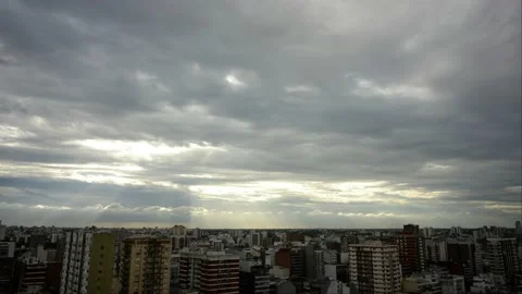 Time lapse of moving clouds and rays of sunlight over Buenos Aires city Stock Footage 147889855