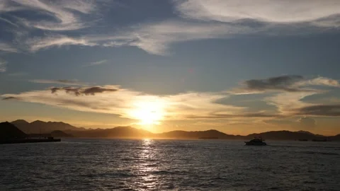 Time lapse of moving clouds and boats during sunset in Hong Kong Stock Footage 160115016