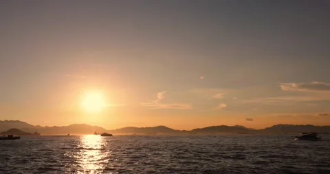 Time lapse of moving clouds and boats during sunset Stock Footage 160145680