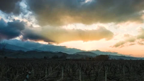 Time Lapse of Moving Clouds and Sunset Over the Field Video stock 180448651