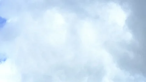 Time-lapse of moving clouds and rain clouds on bright sunny day. Stock Footage 306960940