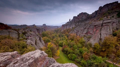 Time lapse with moving clouds at autumn picturesque rock formation Stock Footage 138120335