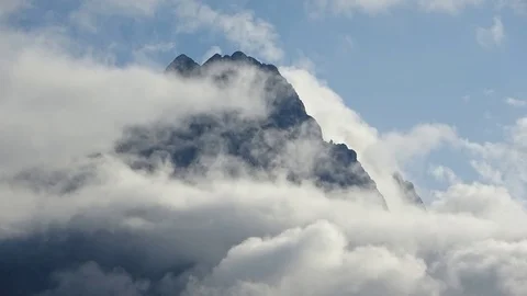 Time-lapse of the moving clouds that cover the Zugspitze Stock Footage 114663138
