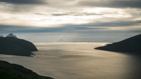 Time lapse of moving clouds high above fjord in Norway Video stock 233782314
