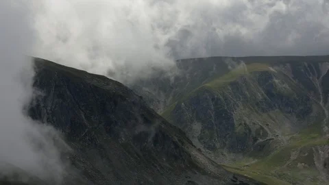 Time lapse of moving clouds in the mountains. Sunny summer day Stock Footage 91446219
