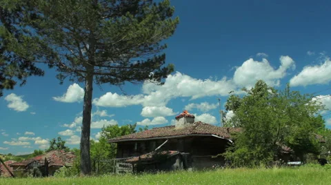 Time lapse with moving clouds over country house in old village Stock Footage 46795535
