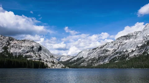 Time Lapse - Moving Clouds Over the Mountains and a Lake Video stock 48430546