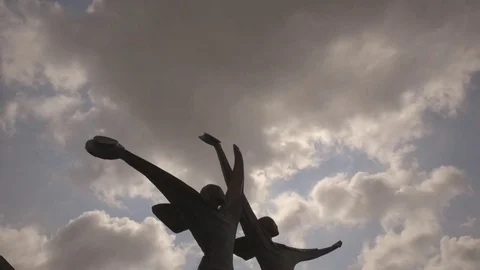 Time lapse of moving clouds over the statue Stock Footage 72619568