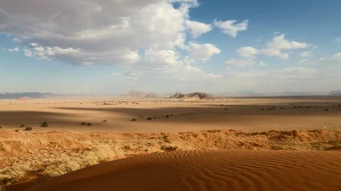 Time lapse - Moving clouds over the Elim dune Vídeo Stock 74008749
