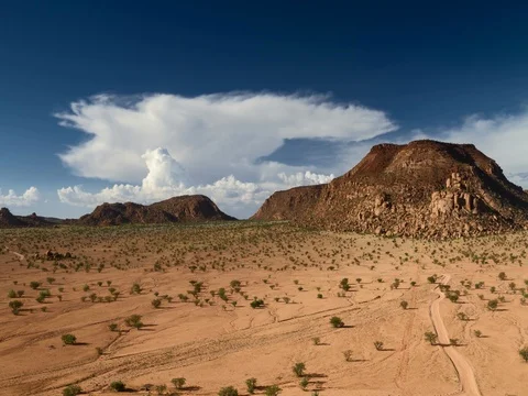 Time lapse - Moving clouds over Damaraland Vídeo Stock 74495788