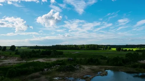 Time Lapse of Moving Clouds over Quarry and Lake. Landscape. Stock Footage