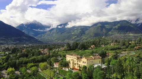 Time lapse - Moving clouds over the city of Meran Video stock 80927026