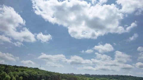 Time lapse of moving clouds over the city Stock Footage 83910779