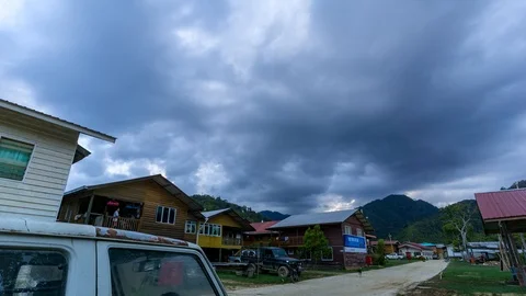 Time lapse of moving clouds over long house at Bario, Sarawak, Malaysia Stock Footage 86008205