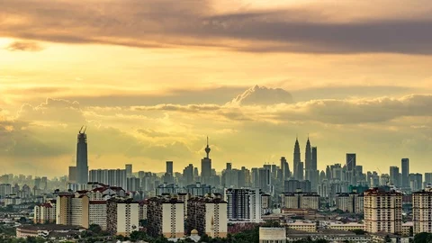 Time lapse of moving clouds over sunset in Kuala Lumpur, Malaysia Stock Footage 86564459