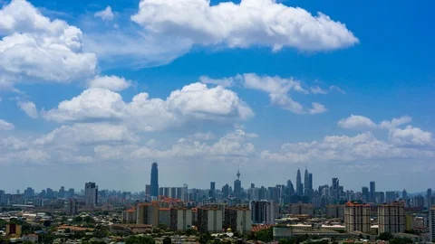 Time lapse of moving clouds over downtown Kuala Lumpur, Malaysia Stock Footage 87333641