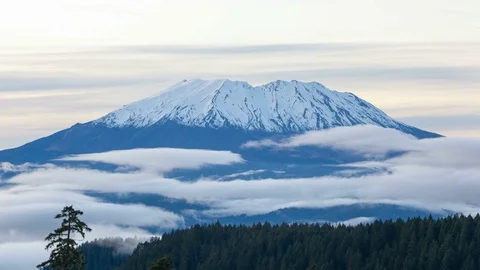 Time lapse of moving clouds over snow covered Mt St Helens in Washington state Stock Footage 91253296