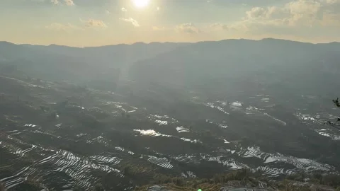 Time-lapse of Moving Clouds over Yuanyang Rice Terraces under Sunlight Video stock 329006611