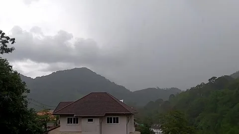 Time Lapse of Moving Clouds Over a House in Tropical Mountains. Stock Footage 348273637