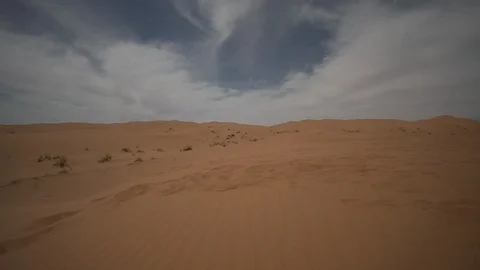 Time lapse of moving clouds in Sahara Desert Morocco sand dunes at night Stock Footage 87075234