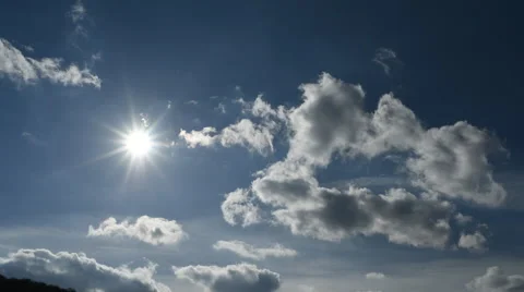 Time Lapse Of Moving Clouds With Sun in the Blue Sky Stock Footage 47515509