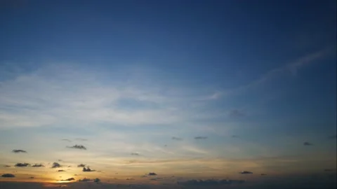 Time lapse moving cloudy golden blue twilight evening sky background after su Stock Footage 130484572