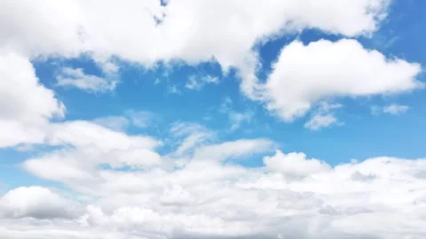 Time-lapse of moving cumulus clouds on a beautiful blue sky day in the summertim Stock Footage 276695054