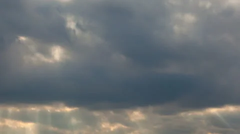 Time Lapse of Moving Dark Stormy Clouds with Beaming Sun Rays at Sunset 1080p Stock Footage 50383629
