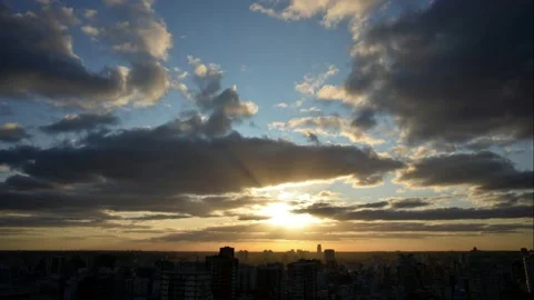 Time lapse of moving flat clouds drifting over big city Buenos Aires at sunset Stock Footage 135612498