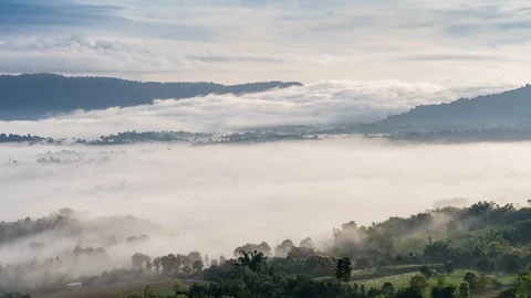 Time lapse of Moving Mist and cloud over the Mountains in the morning Stock Footage 92855916