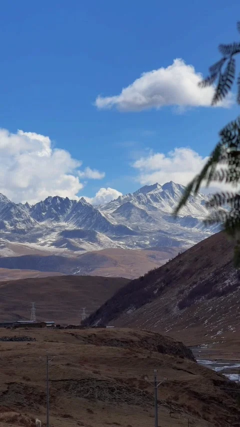 Time-lapse of Moving Sea of Clouds over Snow Mountains Stock Footage 328892421