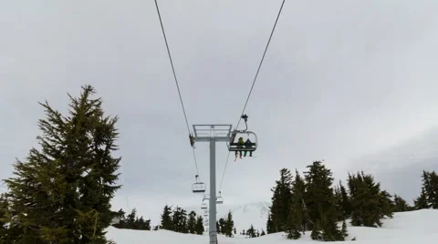 Time lapse of moving ski chair lifts and skiers on the slopes of Mt Hood in OR Stock Footage 61045748