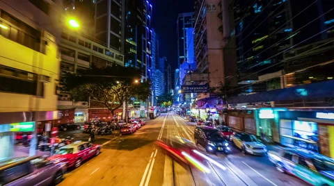 Time lapse moving through modern night city street with skyscrapers. Hong Kong Stock Footage 50321163