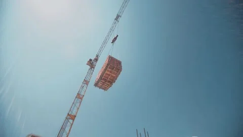 Time-lapse with moving under working constructor crane with bricks Stock Footage 143193937