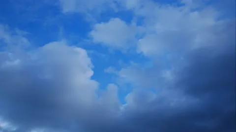Time lapse of moving white cloud with blue sky background at day time Stock Footage 131923839